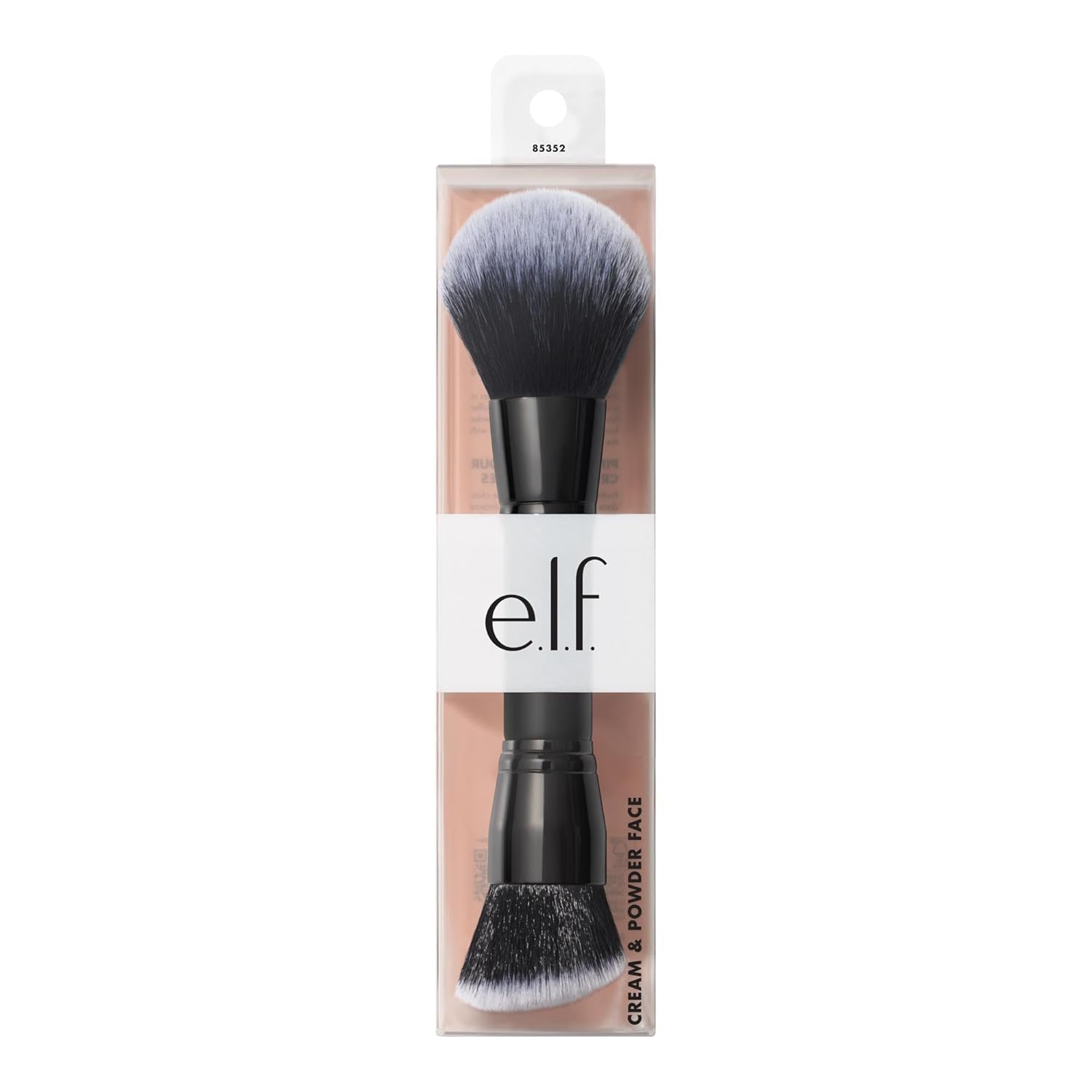 angled buffing brush head shaped to hug facial contours for seamless cream blending