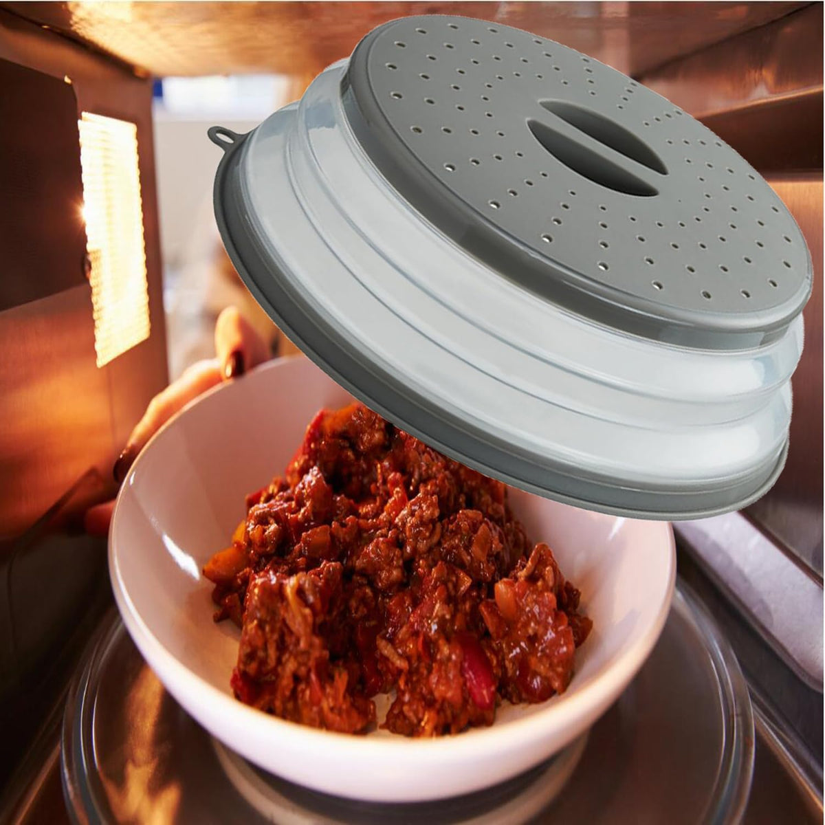 collapsible lid that pops up to 3 inches for tall dishes and folds to 0.75 inches flat