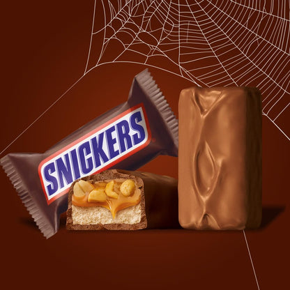 composition of milk chocolate, caramel, nougat, and roasted peanuts