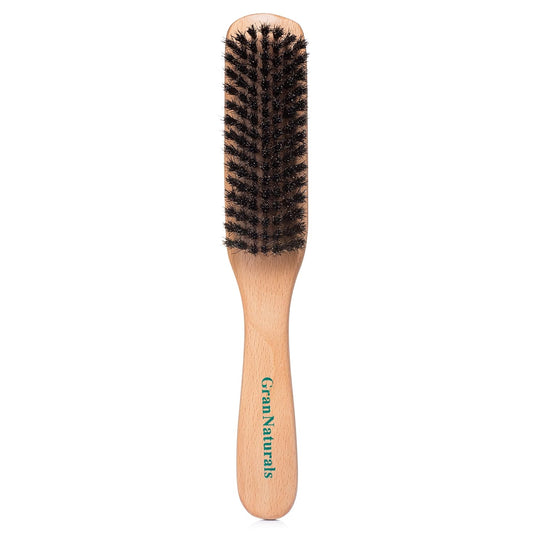 dense boar bristle construction for gripping stubborn strands and distributing natural oils