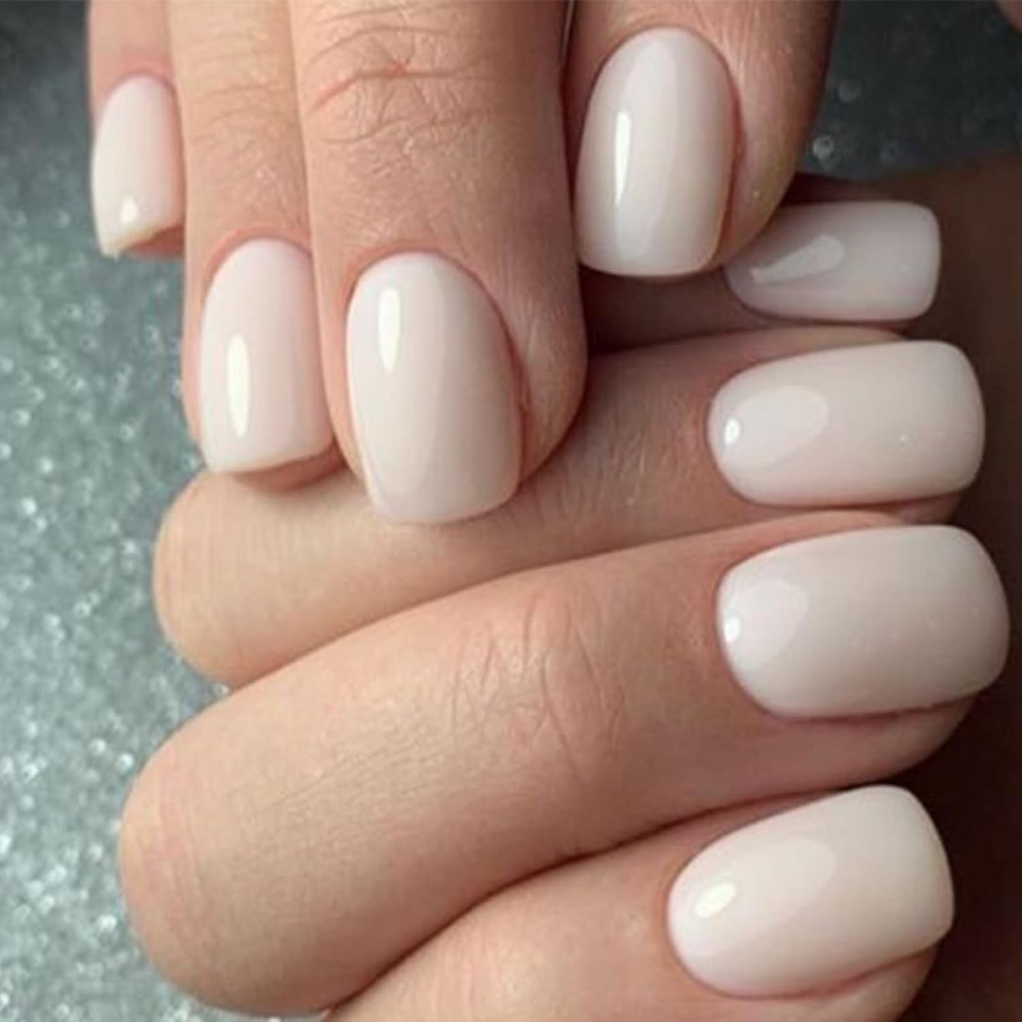 dual attachment system: nail glue for long wear and jelly adhesive tabs for damage-free reuse