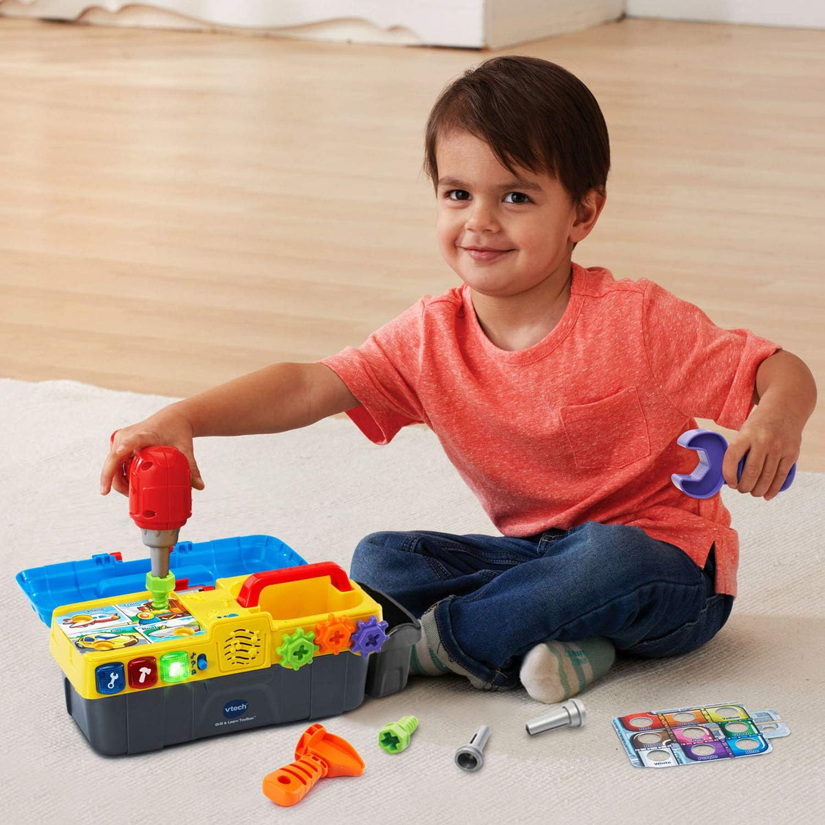 electronic fix-it tray with light-up buttons that play songs and tool sounds
