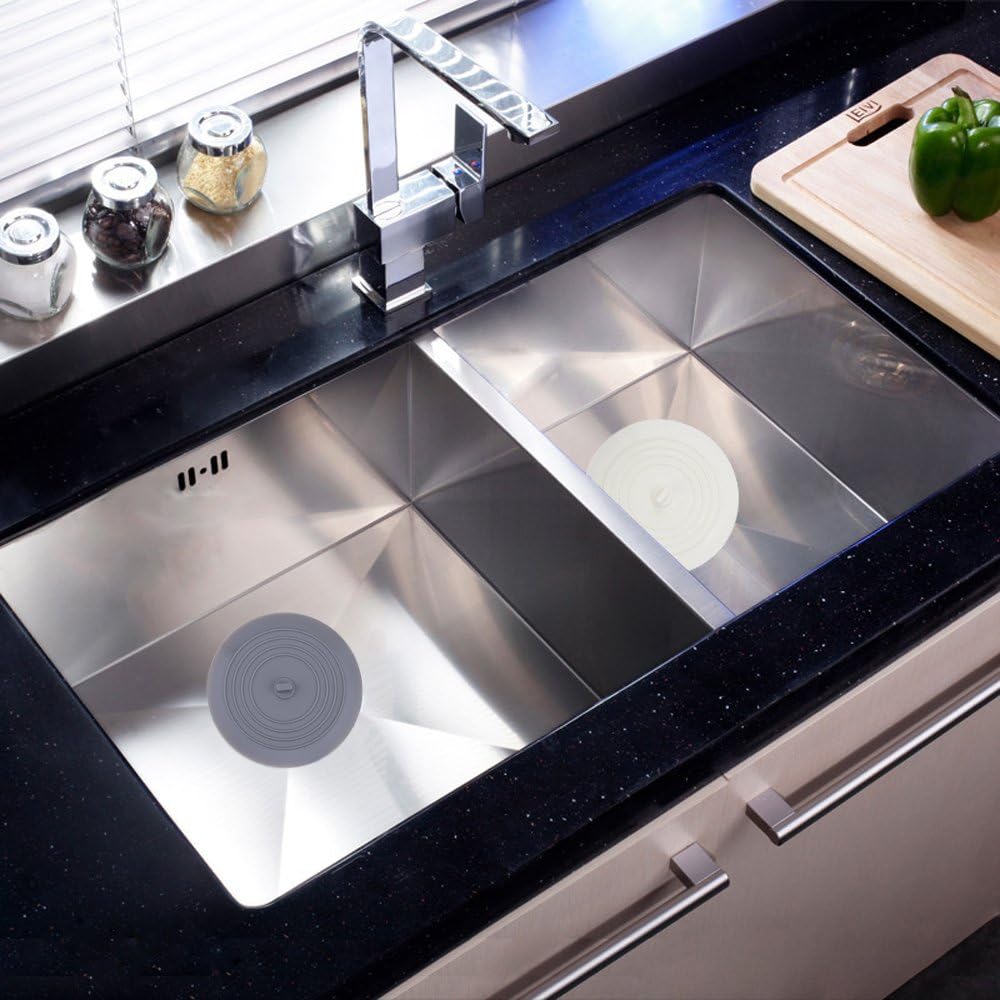 flat suction-style design that sits on top of the drain rather than inserting into it