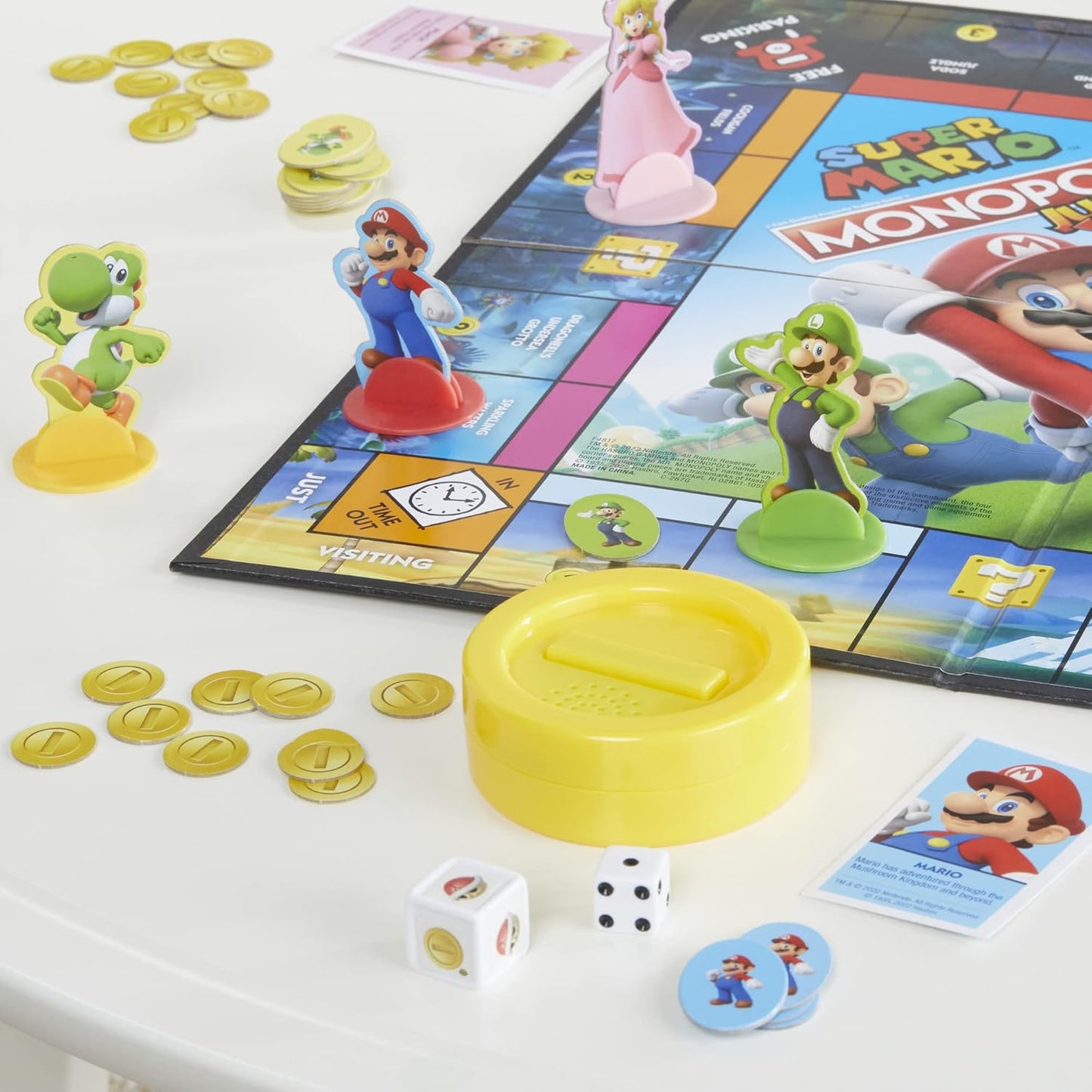 four playable character tokens: mario, peach, yoshi, and luigi