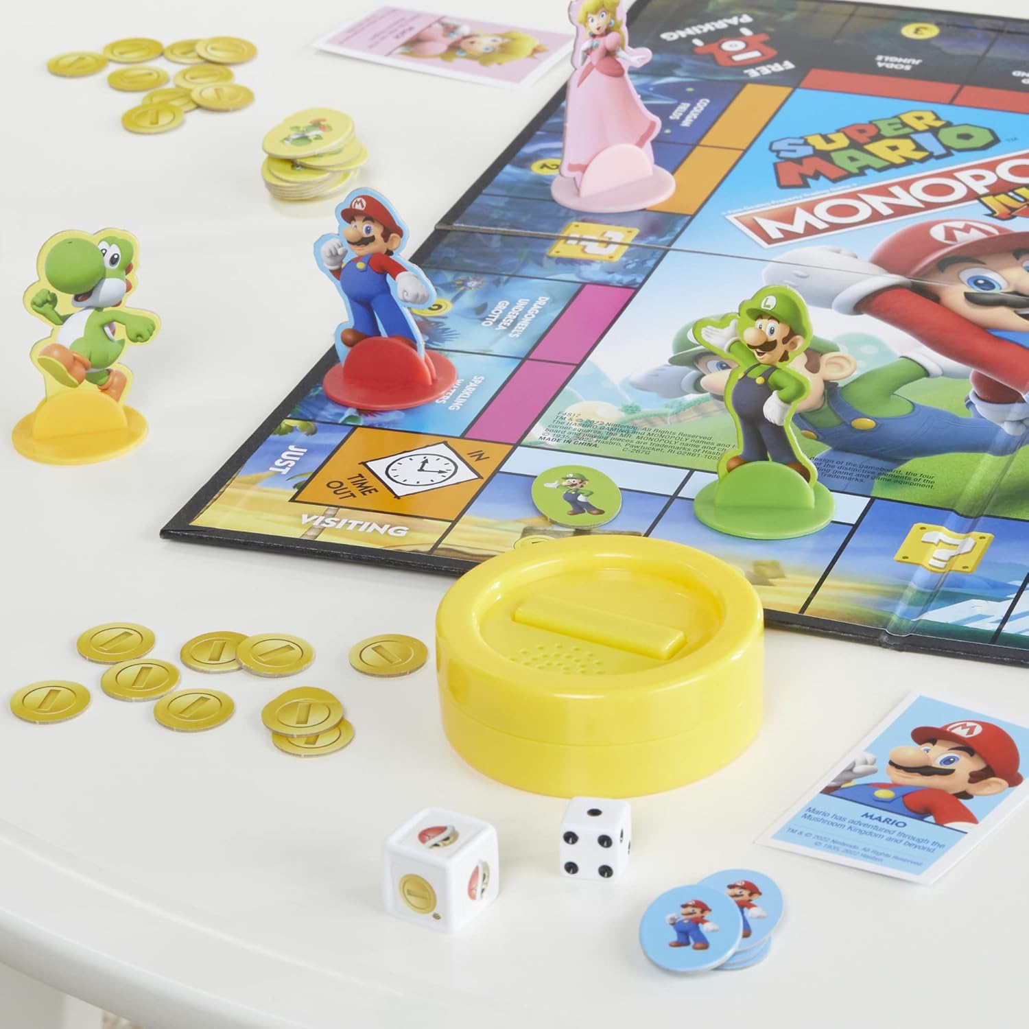 four playable character tokens: mario, peach, yoshi, and luigi