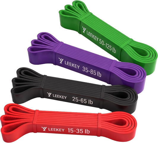 four to five color-coded bands covering 15-125 lb tension (red 15-35, black 25-65, purple 35-85, green 50-125)