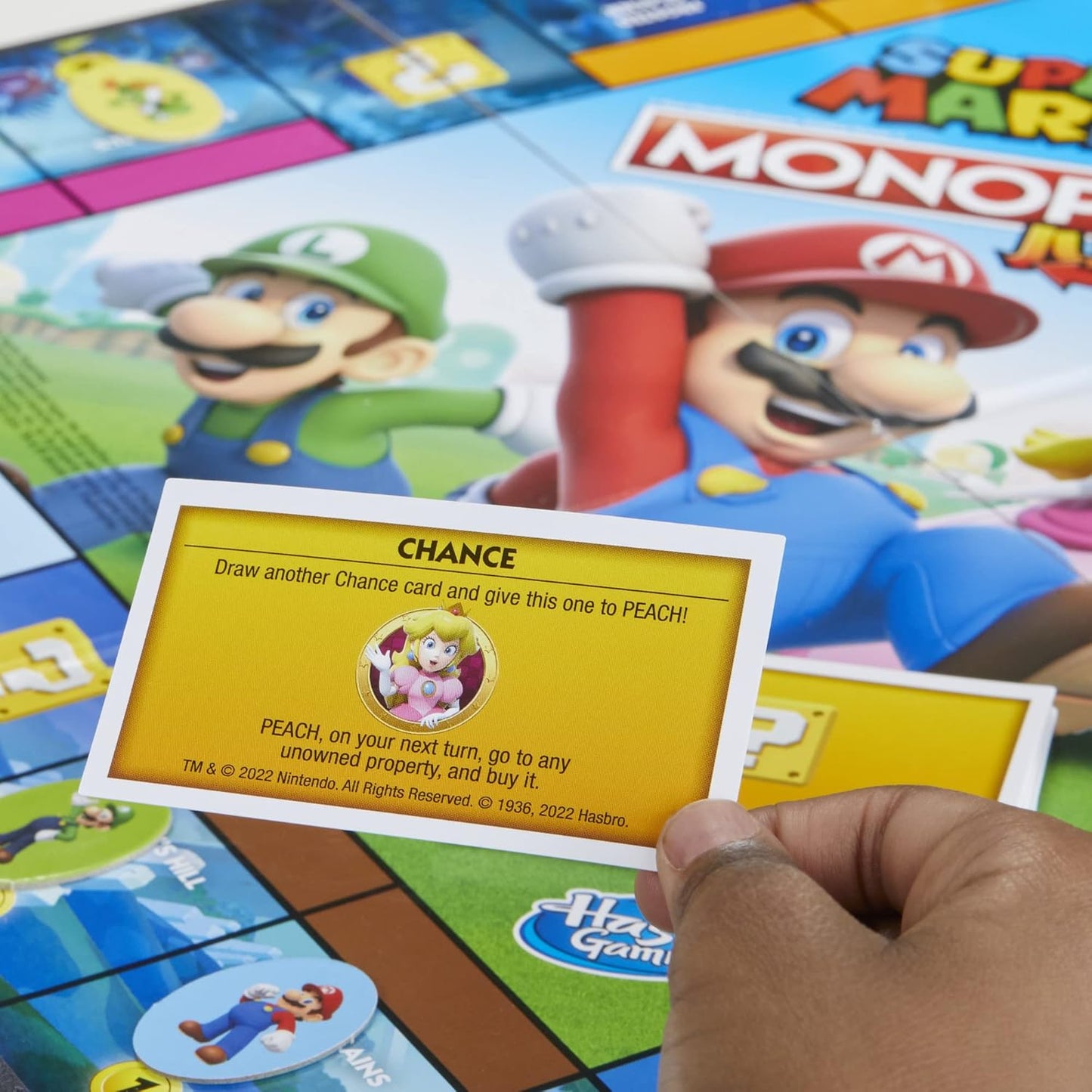 themed mushroom kingdom property spaces including yoshi's hill, cooligan fields, and rock-candy mines
