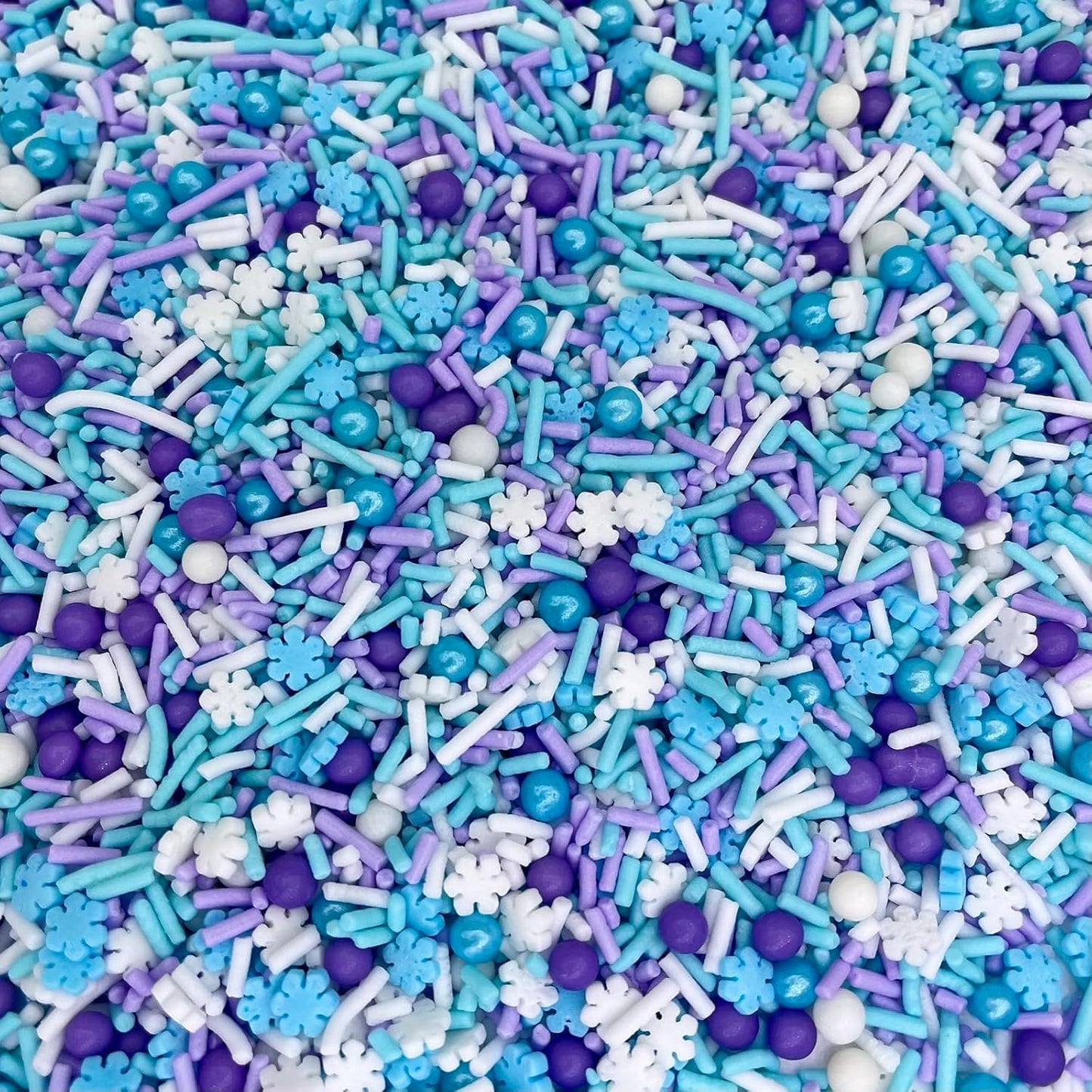 variety of sprinkle shapes including snowflakes, confetti, and metallic pieces
