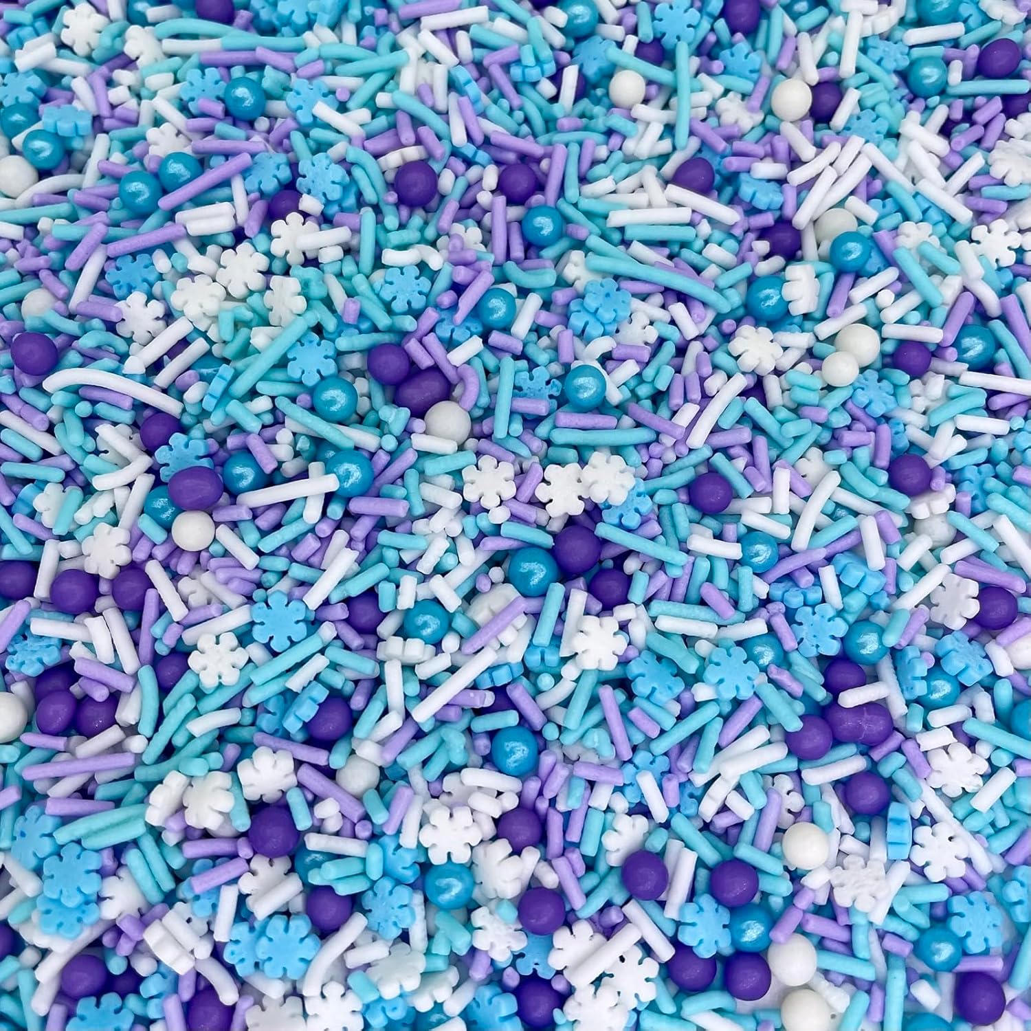 variety of sprinkle shapes including snowflakes, confetti, and metallic pieces